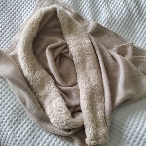 Soft beige shawl with hook closure and fur trim